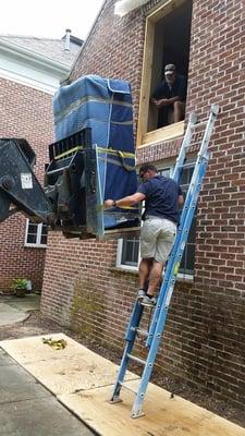 Putting a 1,200 pound gun safe into a second floor