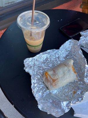 Honey lavender iced latte with oat milk and a chorizo breakfast burrito.