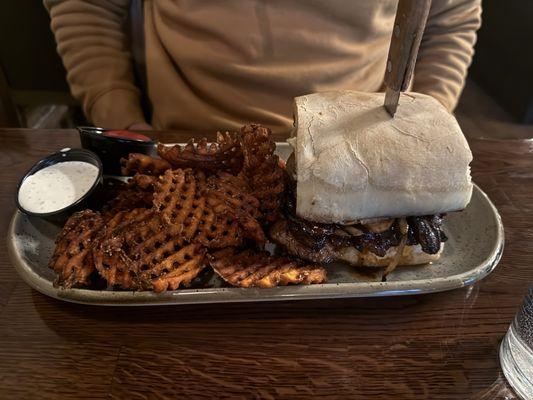 Steakhouse sandwich with sweet potato waffle fries