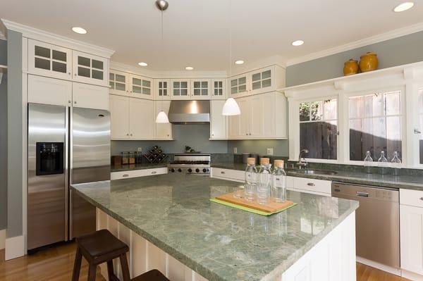 Chef's kitchen with high-end stainless steel appliances, a large island and a pantry