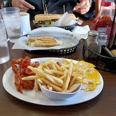 Breakfast special bacon and eggs and my buddy had the steak sandwich so big he had to take it home.