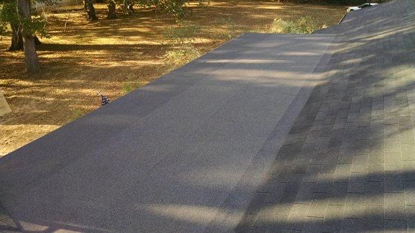 Rolled roofing installed over a low slope porch that isn't steep enough for shingle use.