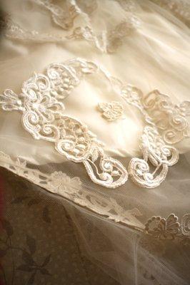 Detail shot of wedding gown. 2/3