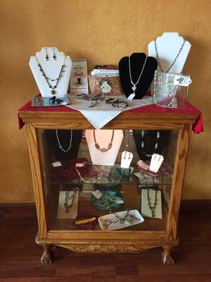 We carry locally crafted jewelry and fused glass! Perfect gift or souvenir from the coast.