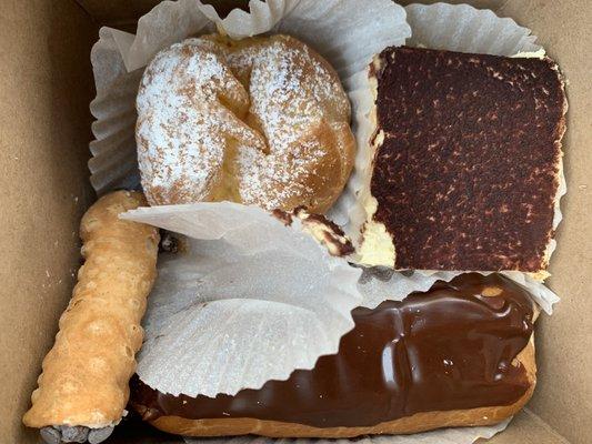 Clockwise from top left: cream puff, tiramisu, cannoli and chocolate eclair