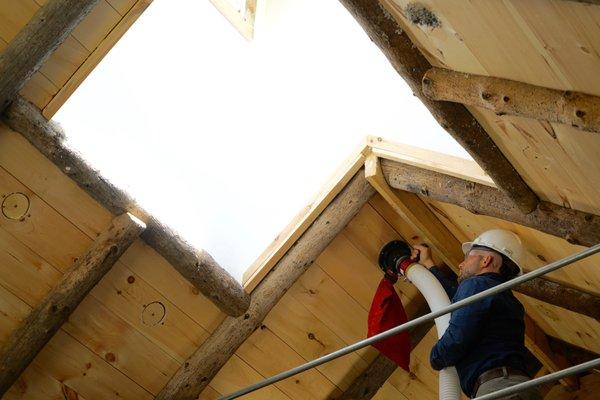 Barn roof dense pack insulation