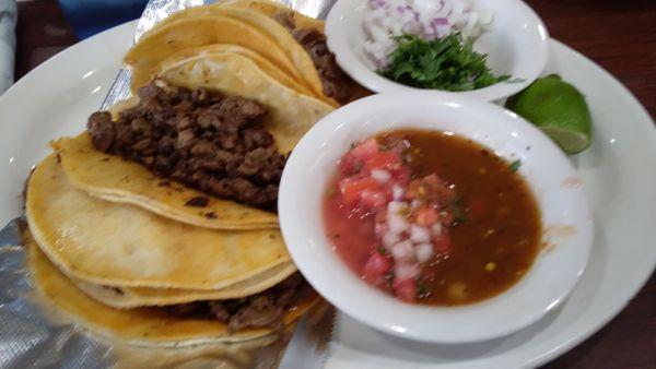 Carnitas, carne asada, beef and chorizo tacos