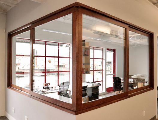 Solid walnut framed sliding glass corner office windows