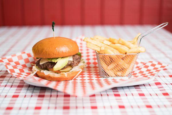 Avocado cheeseburger with fries