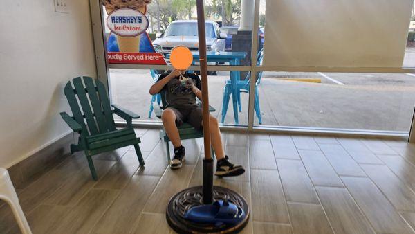 Relaxing & thoroughly enjoying his cookies n cream ice cream at Scratched Ice.