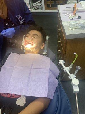 My son getting his bottom braces on