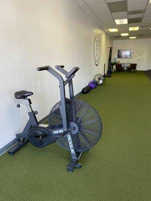 Rogue Echo Bike, Med Balls, Slam Balls, Sled, Turf for a varieties of exercises and imitation of the playing field