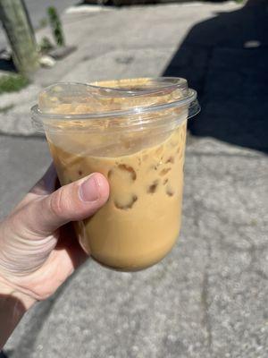 Iced vanilla latte with oat milk