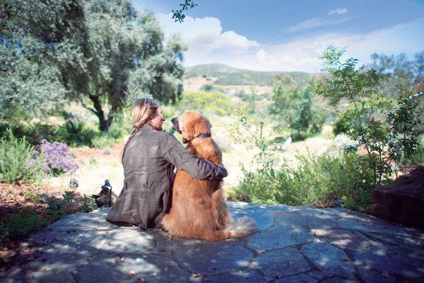 A woman and her dog enjoying the view.