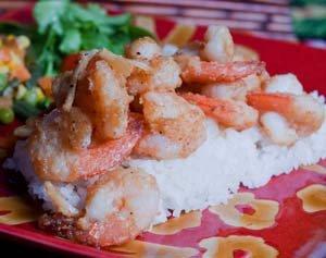 World Famous Garlic Shrimp with fresh steamed rice, organic salad, and potato/Mac salad.