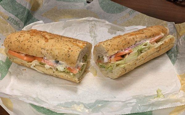 Footlong Turkey Breast on Italian Herbs & Cheese with Lettuce, Tomatoes, Pickles, Black Olives, Red Onions, Jalapeños, Mayonnaise, Vinegar