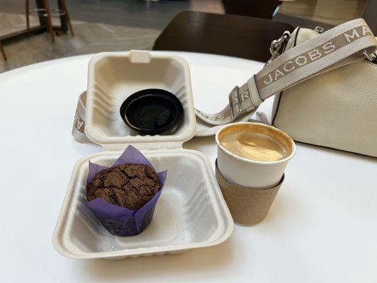 Almond milk cortado and a chocolate gluten-free muffin.