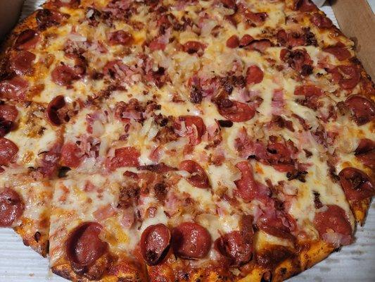 Pepperoni, bacon, ham, and onions.