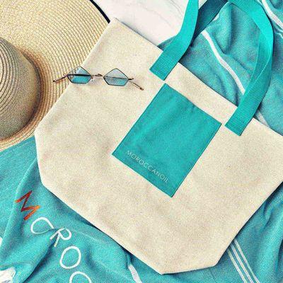 FREE Beach Tote with purchase of $50 or more of Moroccanoil products, while supplies last.