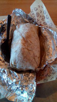 Chipotle burrito. Served in foil. Rate it a "B-" or thereabouts. A little expensive for what you get.