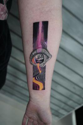 This Tame Impala album cover tattoo merges surrealism with vibrant colors, creating a hypnotic design that captures the band's essence.