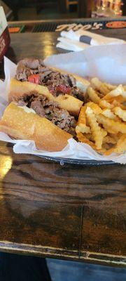 T-Rex cheesesteak (with red peppers), extra meat and fries. On point.