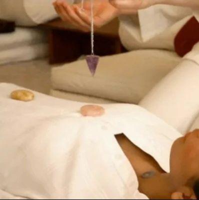 Chakra cleansing/balancing utilizing crysteal and sound healing.