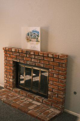 The house in painted form above the fireplace.