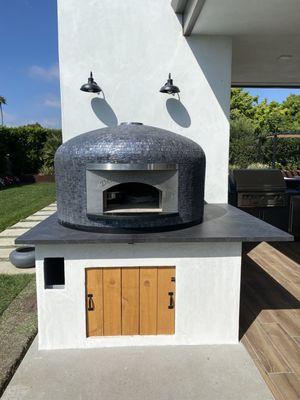 Deckton countertops around pizza oven.