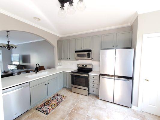 My costumer was so happy with how her kitchen turned out after refinishing the cabinets and painting the walls.