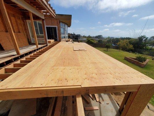 1200 square foot deck replacing old deck due to water damage of 3rd party.