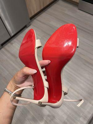 Louboutin heels with protective cover on bottom (worn a couple times before this picture was taken)