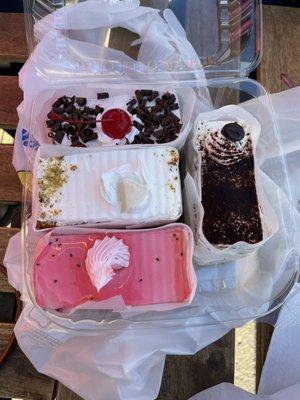 Cake slices: black forest (top), rasmalai (middle), falooda (bottom), tiramisu (right)