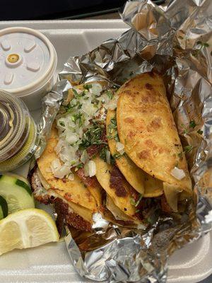 Birria tacos with three different sauces