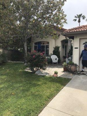 two employees washing my windows and power wash my home & my 3 car garage doors