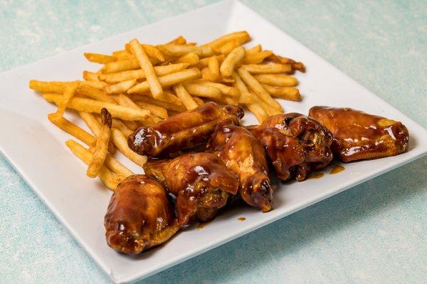 Honey BBQ chicken wings and french fries