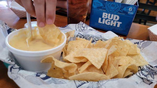 Chips and queso are not on the menu. So good I can't get a pick without a hand reaching.