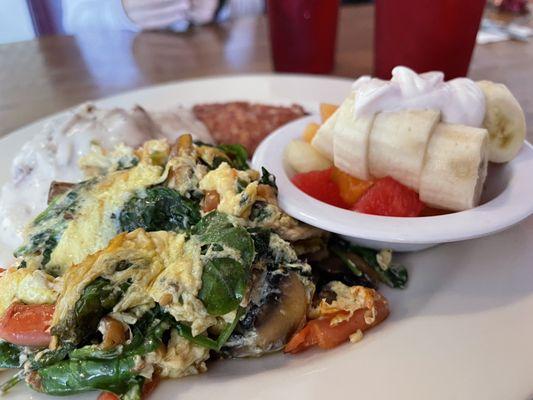 The Country: Corned Beef Hash, eggs scrambled w/ spinach, mushrooms, & tomatoes. Biscuits & Gravy and fruit. 5 out of 5!