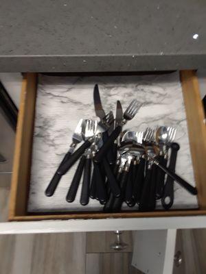 Silverware in kitchen drawer.