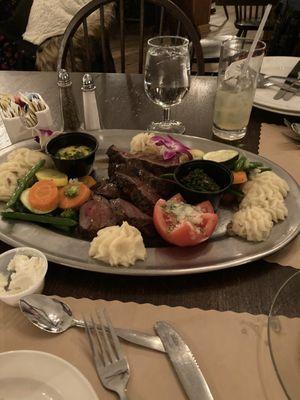 Filet mignon, roasted vegetables and mashed potato.