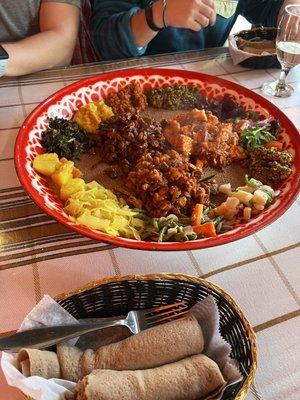 Fish, vegetables, beef tibs, chicken tibs, injera