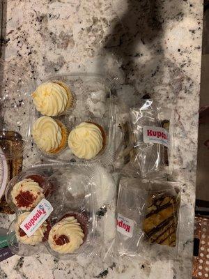 Keto red velvet cupcake, lemon cupcake, and 2 different types of gooey bars.