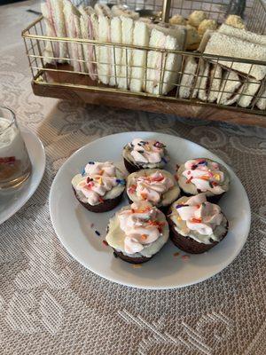 Brownie bites with icing.