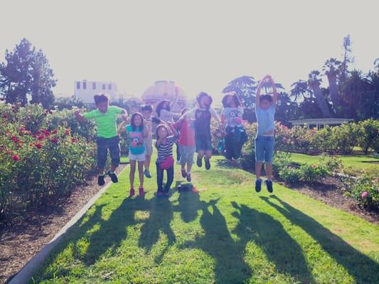 Students and Teachers playing in the Rose Garden after our summer field trip to the NHM and Science Center