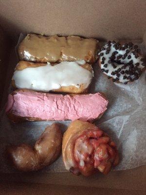 Maple, vanilla, strawberry cream sticks. Cake donut with chocolate chips, sour cream stick, strawberry donut