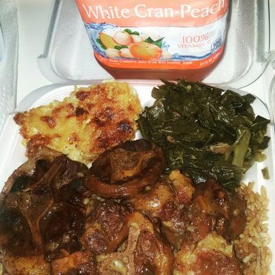 Oxtails pigeon peas and rice collard greens and macaroni and cheese forgot to get me a sweet tea