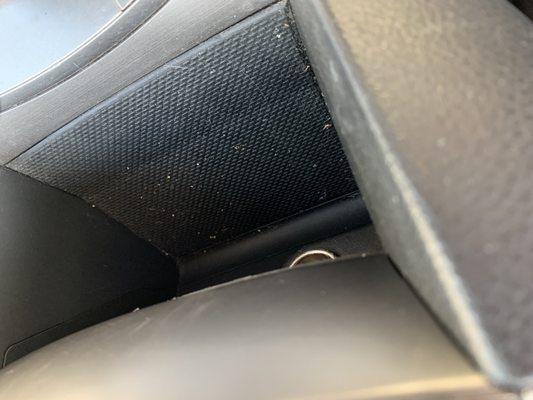 Cup holder area clearly not vacuumed or wiped.