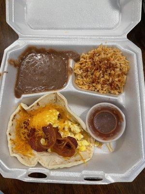 Bacon egg and cheese breakfast taco with rice and beans and HOT salsa