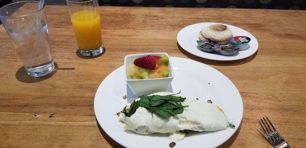 Build-your-own eggwhite omelette with spinach, mushrooms, and cheddar cheese. With a side of fresh fruit and an English muffin with jellies.