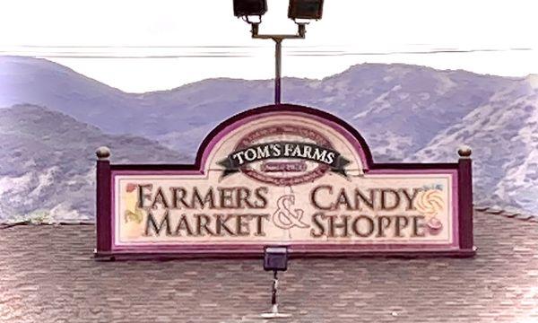 Their rooftop sign against the backdrop of the local mountains.